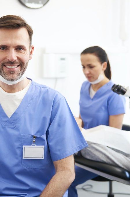 portrait-of-smiling-male-dentist-in-dentist-s-clinic.jpg